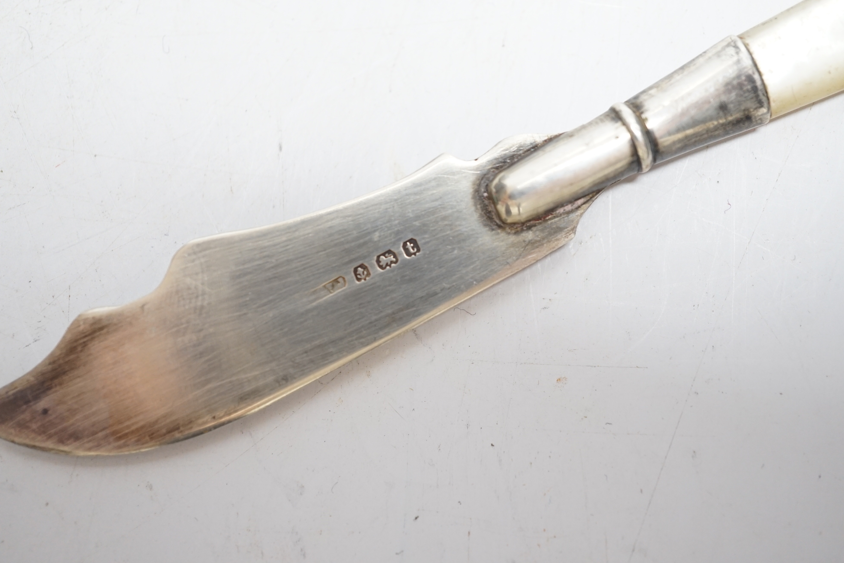 A late Victorian silver baby rattle, with coral teether, by George Unite, 11.6cm and a small silver butter knife.